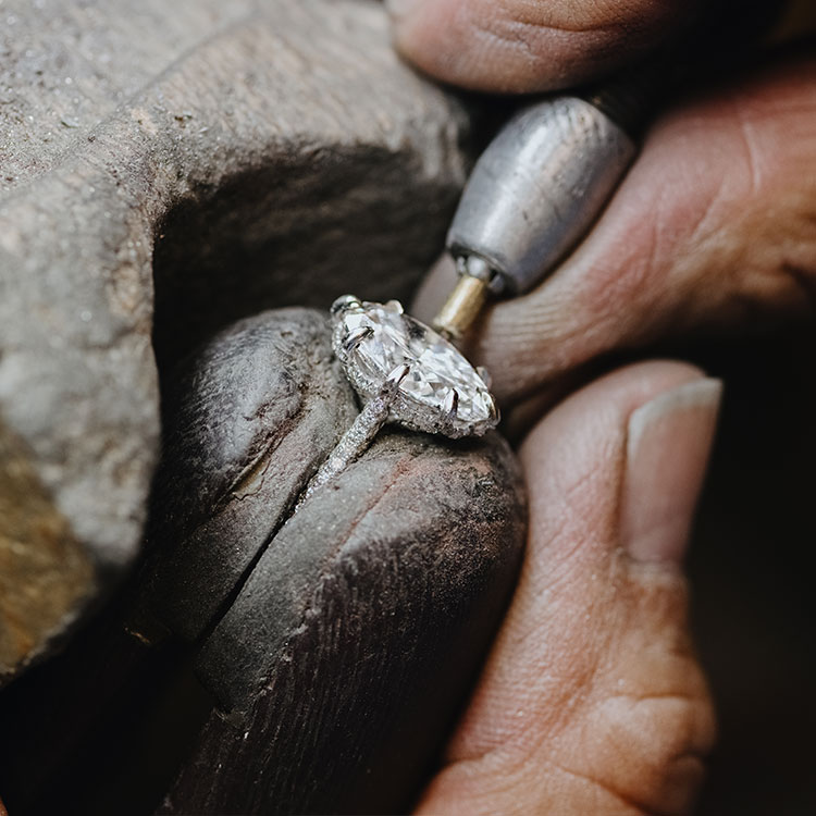 A custom diamond ring being worked on